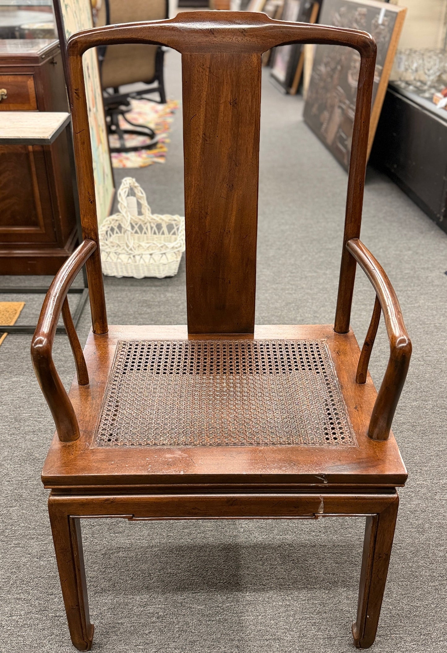 A 9-piece traditional wooden dining set featuring a large rectangular table, two matching armchairs, and six side chairs with woven rattan backrests.