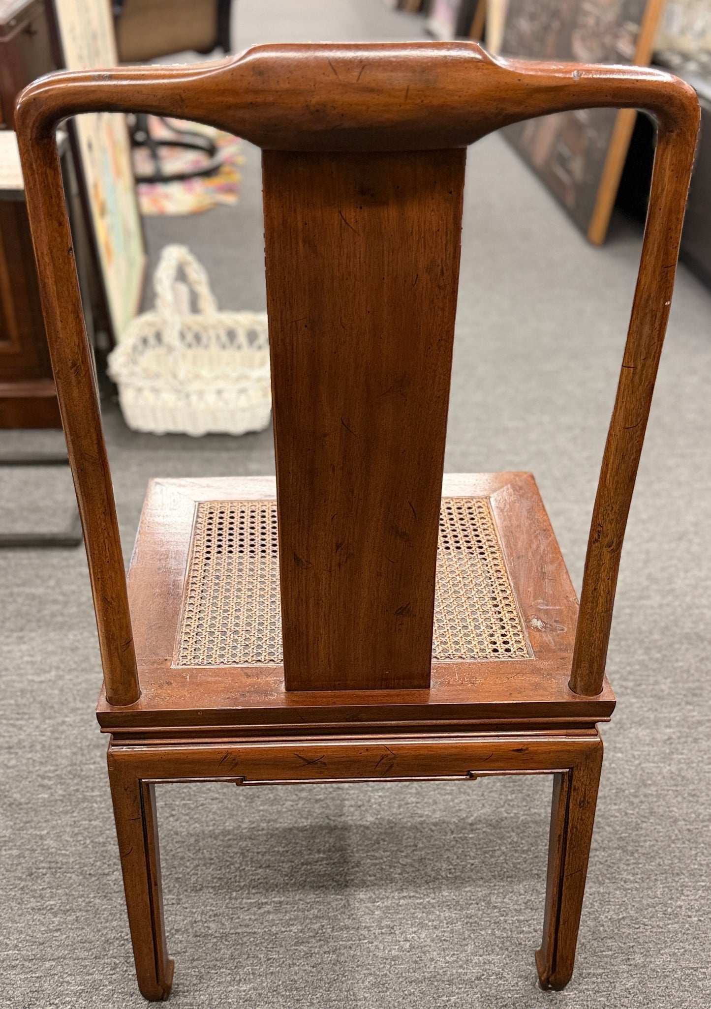 A 9-piece traditional wooden dining set featuring a large rectangular table, two matching armchairs, and six side chairs with woven rattan backrests.
