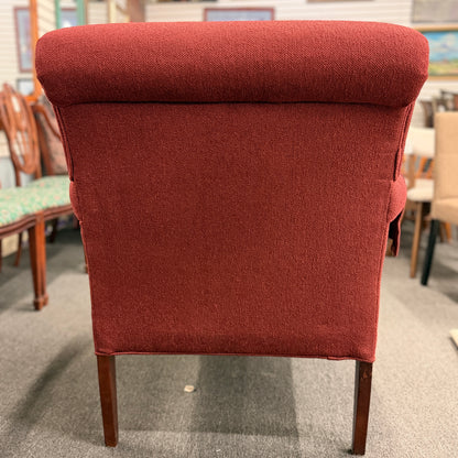 A contemporary plush fabric armchair featuring wide rounded track arms, a T-cushion seat, and a supportive square backrest.