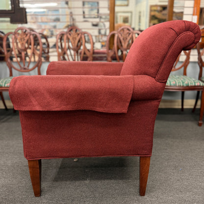 A contemporary plush fabric armchair featuring wide rounded track arms, a T-cushion seat, and a supportive square backrest.