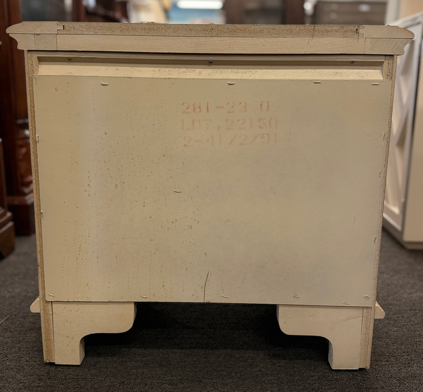 Bernhardt three-drawer wood nightstand with a light finish, routed drawer details, brass knobs, a brass bail pull, and a scalloped base.