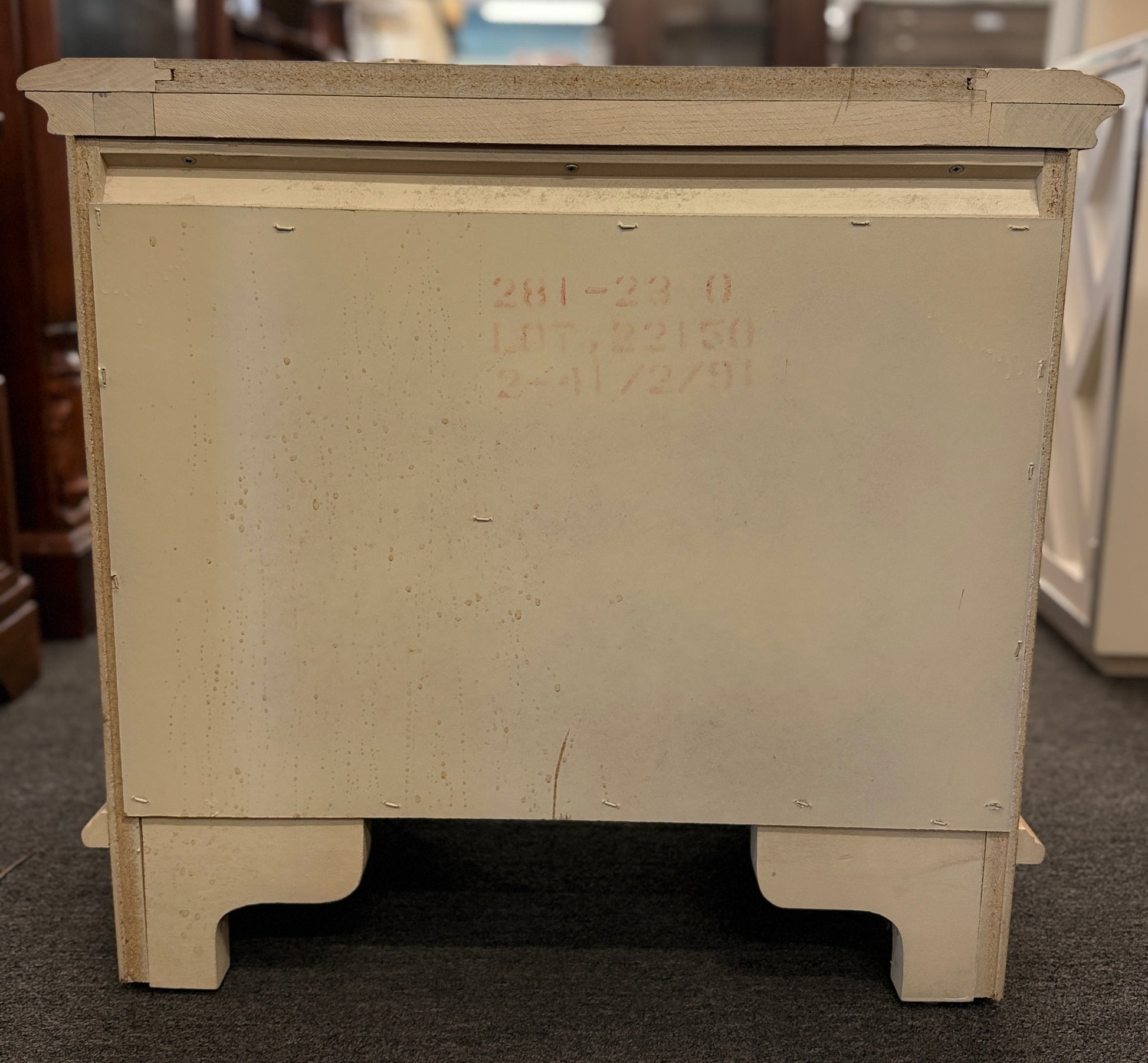 Bernhardt three-drawer wood nightstand with a light finish, routed drawer details, brass knobs, a brass bail pull, and a scalloped base.