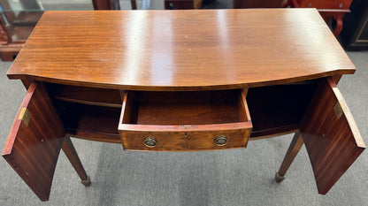 Traditional wood server featuring three front storage compartments with brass ring pulls, a scalloped bottom edge, and distinctive circular wood grain side panels.