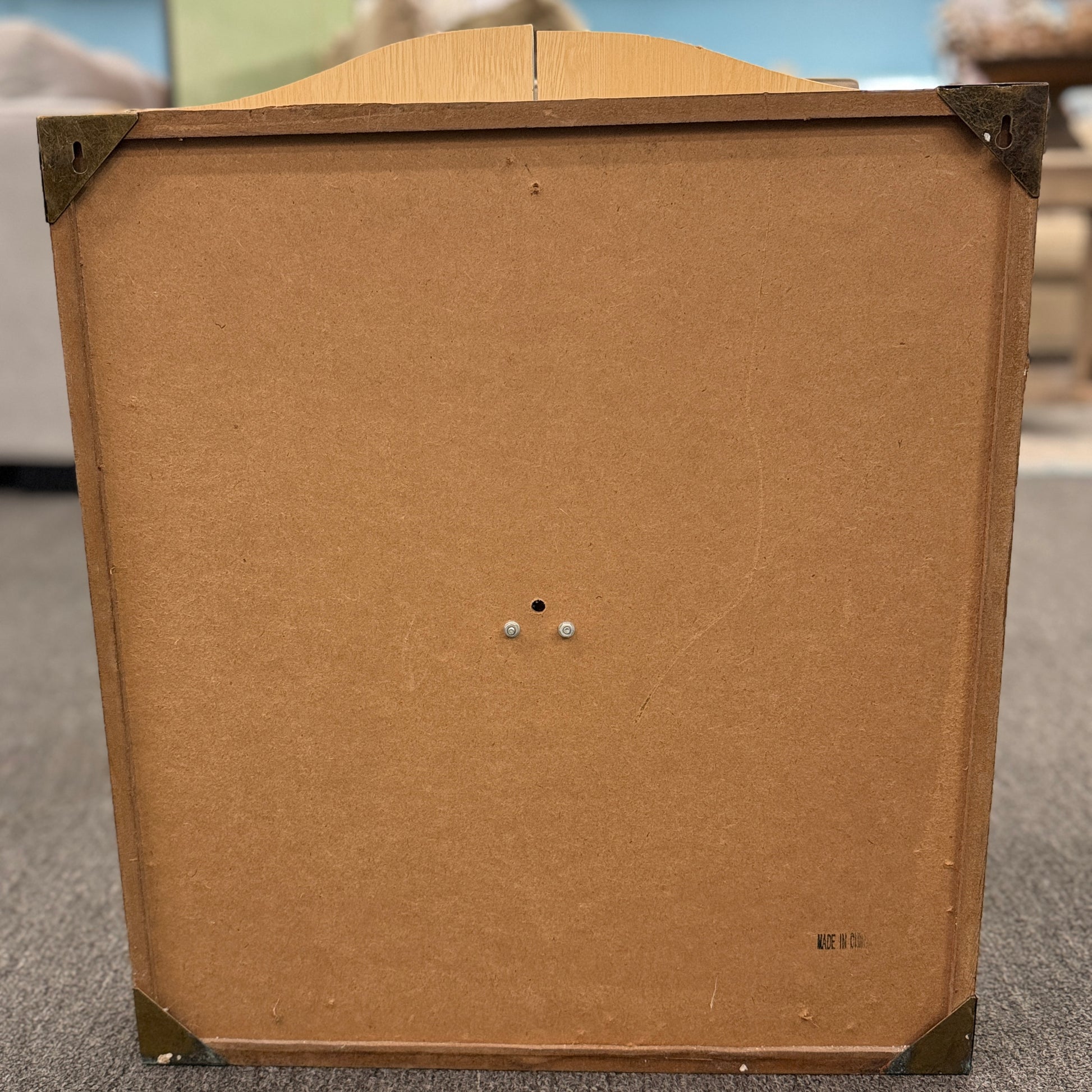 Wood dartboard cabinet opened to reveal a classic bristle dartboard with green Cricket scoreboards on the inside of both cabinet doors.