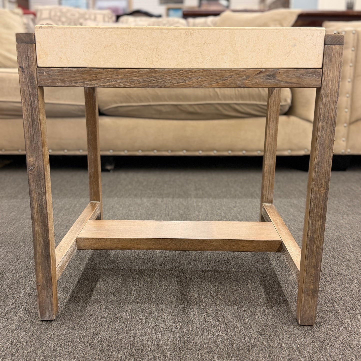 Square end table featuring a thick light-colored stone top, distressed wood frame, and a lower crossbar shelf with rustic styling.