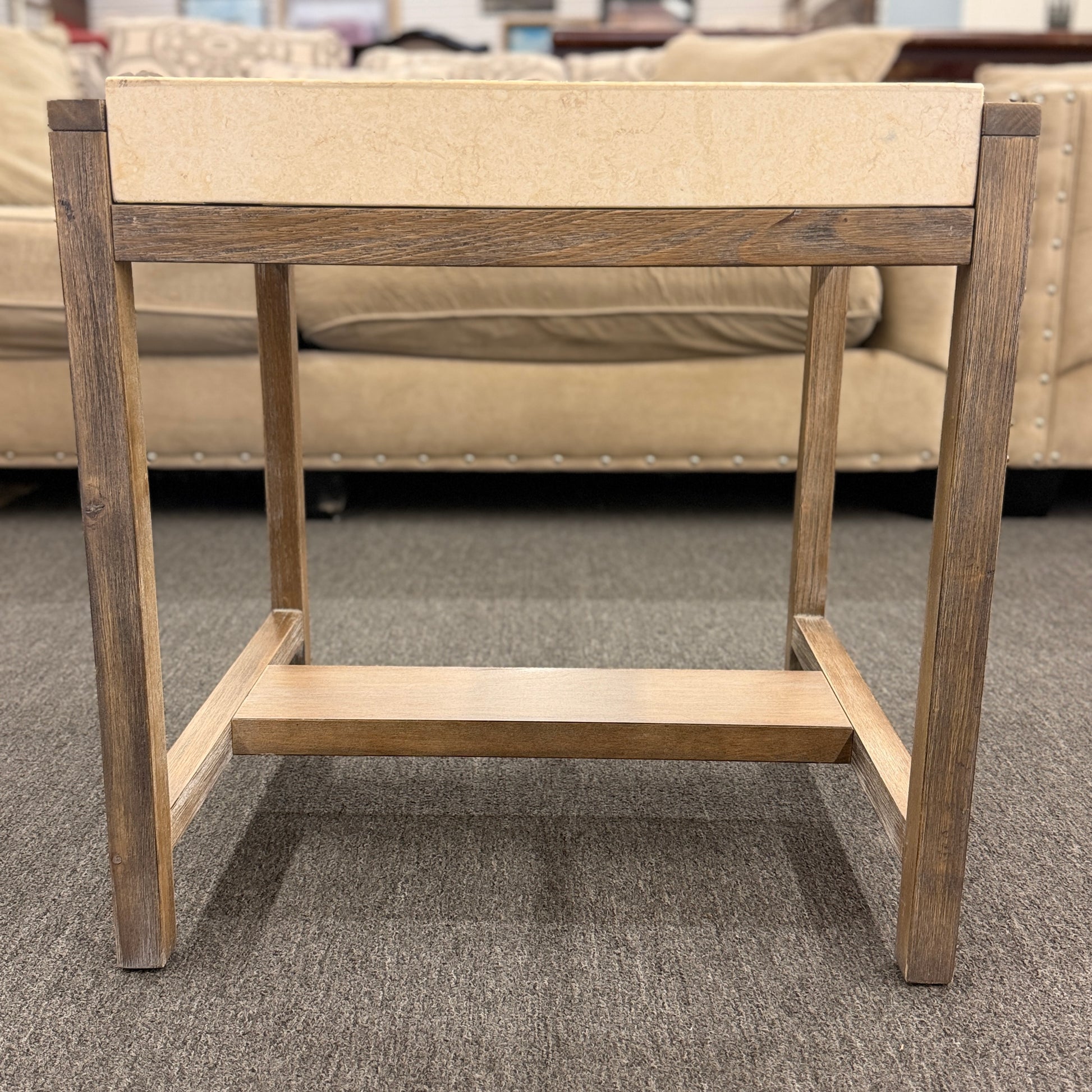 Square end table featuring a thick light-colored stone top, distressed wood frame, and a lower crossbar shelf with rustic styling.