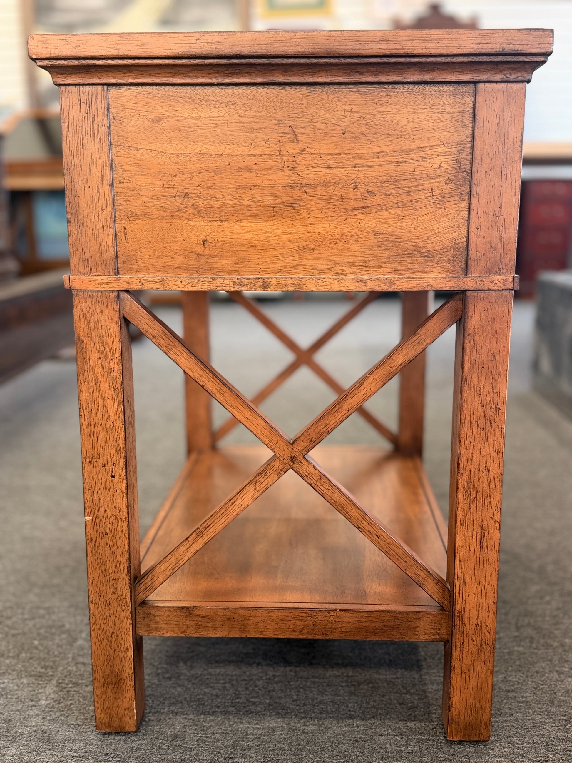 A traditional Ethan Allen wooden nightstand featuring a single top drawer, X-brace side panels, and an open lower shelf in good condition.