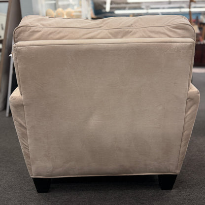 A contemporary single-seat chaise lounge upholstered in plush cream microfiber with track arms and a back cushion in good condition.