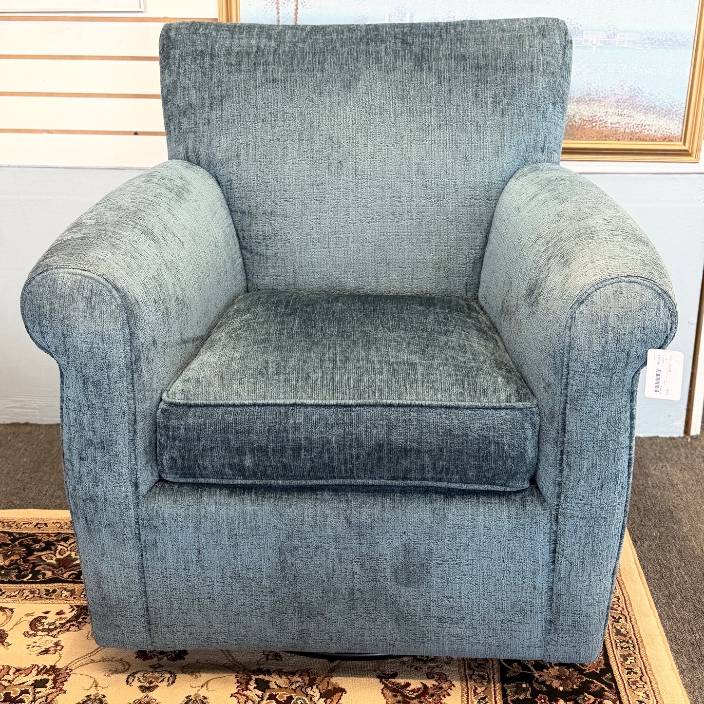A premium Arhaus plush upholstered swivel armchair in excellent condition, featuring rolled arms, a thick seat cushion, and a high backrest.