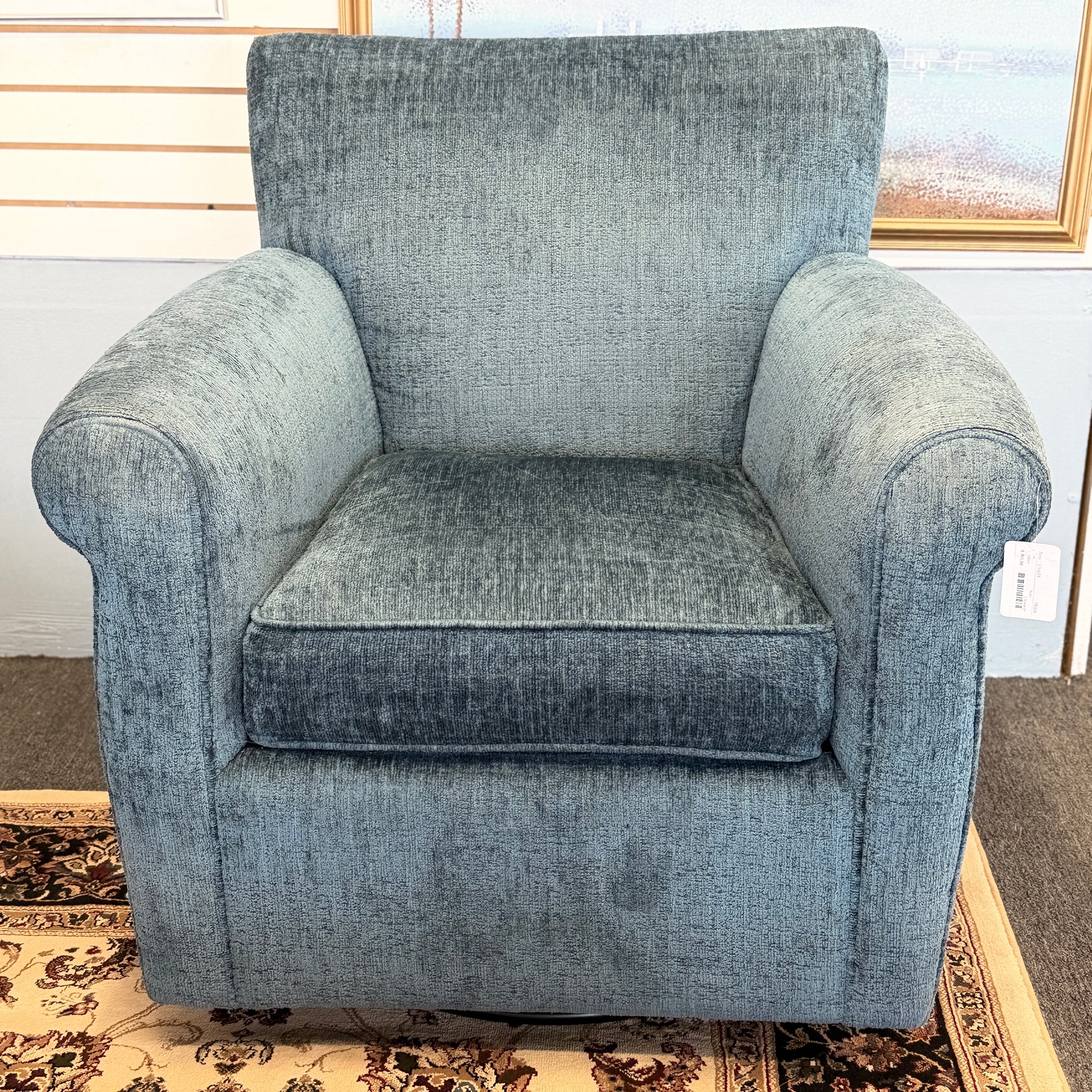 A premium Arhaus plush upholstered swivel armchair in excellent condition, featuring rolled arms, a thick seat cushion, and a high backrest.