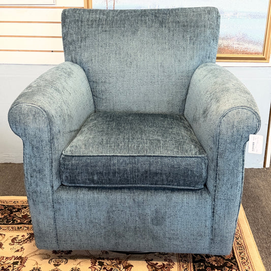 A premium Arhaus plush upholstered swivel armchair in excellent condition, featuring rolled arms, a thick seat cushion, and a high backrest.