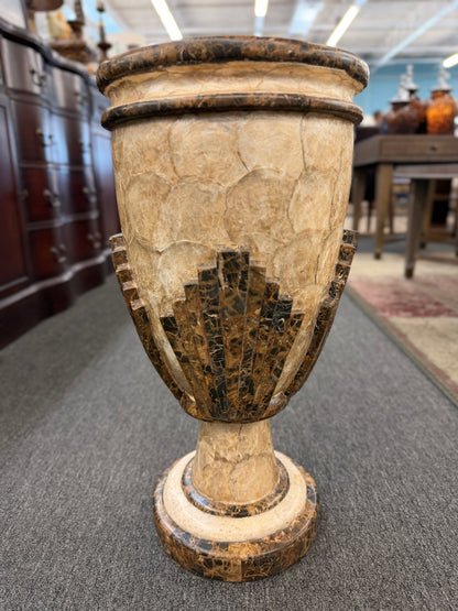 A tall Art Deco-inspired decorative vase featuring a textured light capiz-style overlapping circular pattern body with dark faux-marble geometric stepped accents and base.