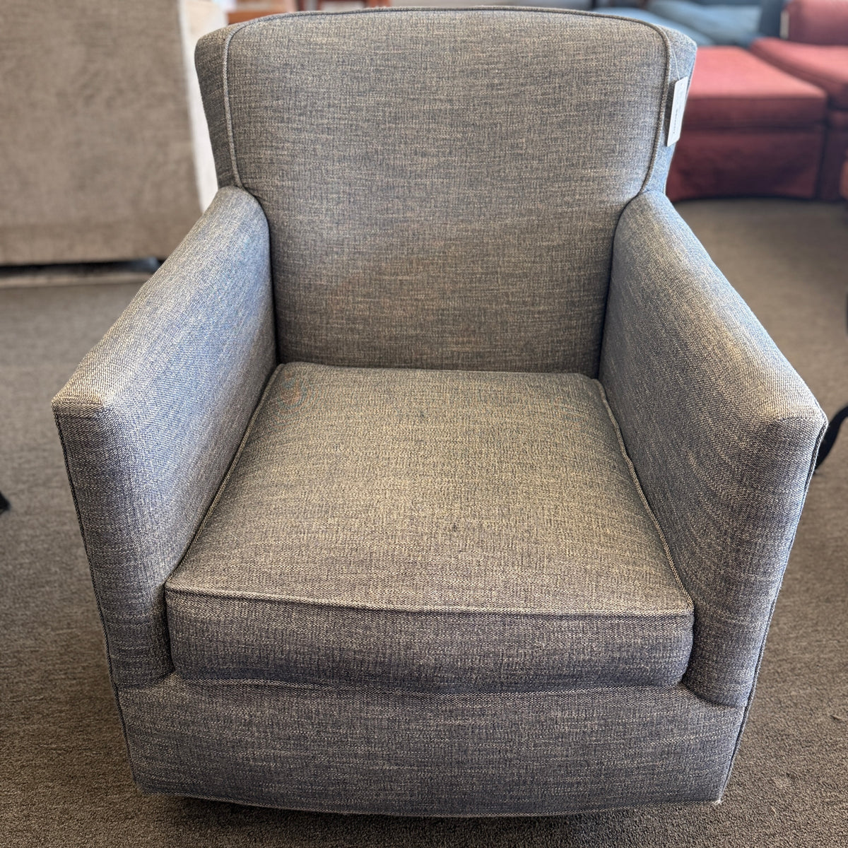 A classic Bassett armchair upholstered in a textured light grayish-blue fabric in excellent condition.
