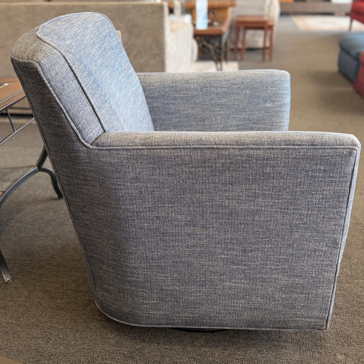 A classic Bassett armchair upholstered in a textured light grayish-blue fabric in excellent condition.