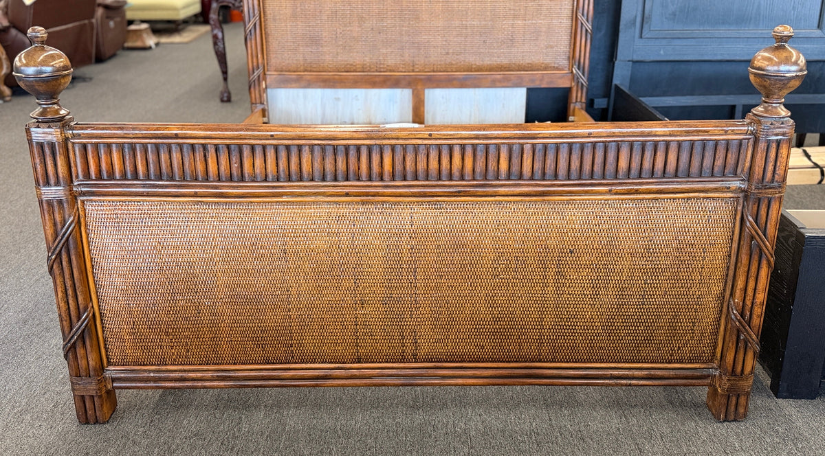 Carved wooden queen bed frame featuring arched woven rattan and cane panels on the headboard and footboard, accented with fluted posts and finials in excellent condition.