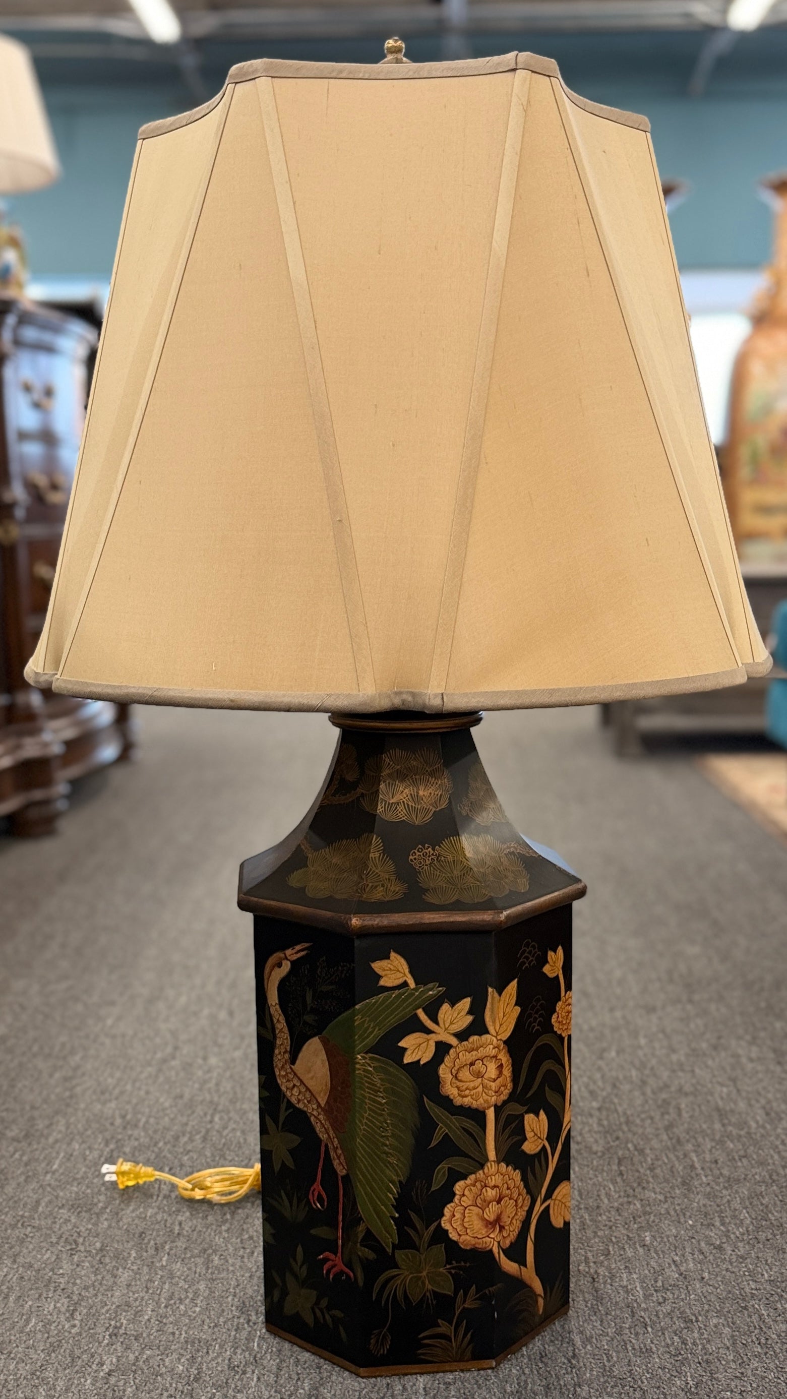A 37-inch decorative table lamp featuring a tapered hexagonal metal base painted with traditional cranes and flowers, topped with a structured beige fabric shade.