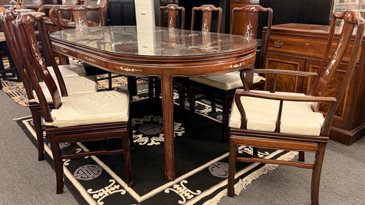 Chinoiserie inlaid wood 9pc oval dining set featuring a glass top table and mother of pearl detail at 2nd Debut Houston consignment showroom
