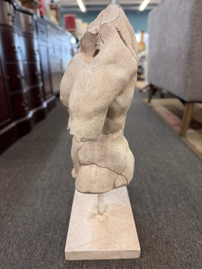 Classical-style male torso sculpture with a distressed stone-look finish, realistic crackled detailing, and a square display base.