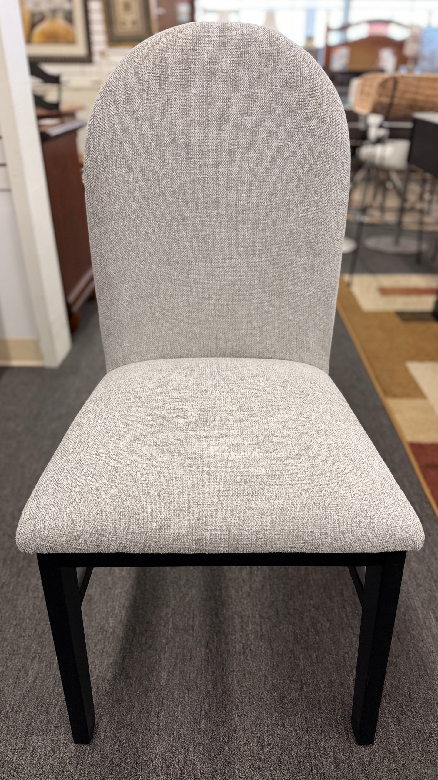 A contemporary 5-piece dining set featuring a square dining table with a glossy stone-look top and four tall upholstered matching chairs.
