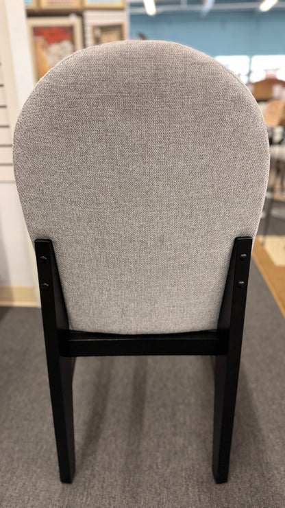 A contemporary 5-piece dining set featuring a square dining table with a glossy stone-look top and four tall upholstered matching chairs.