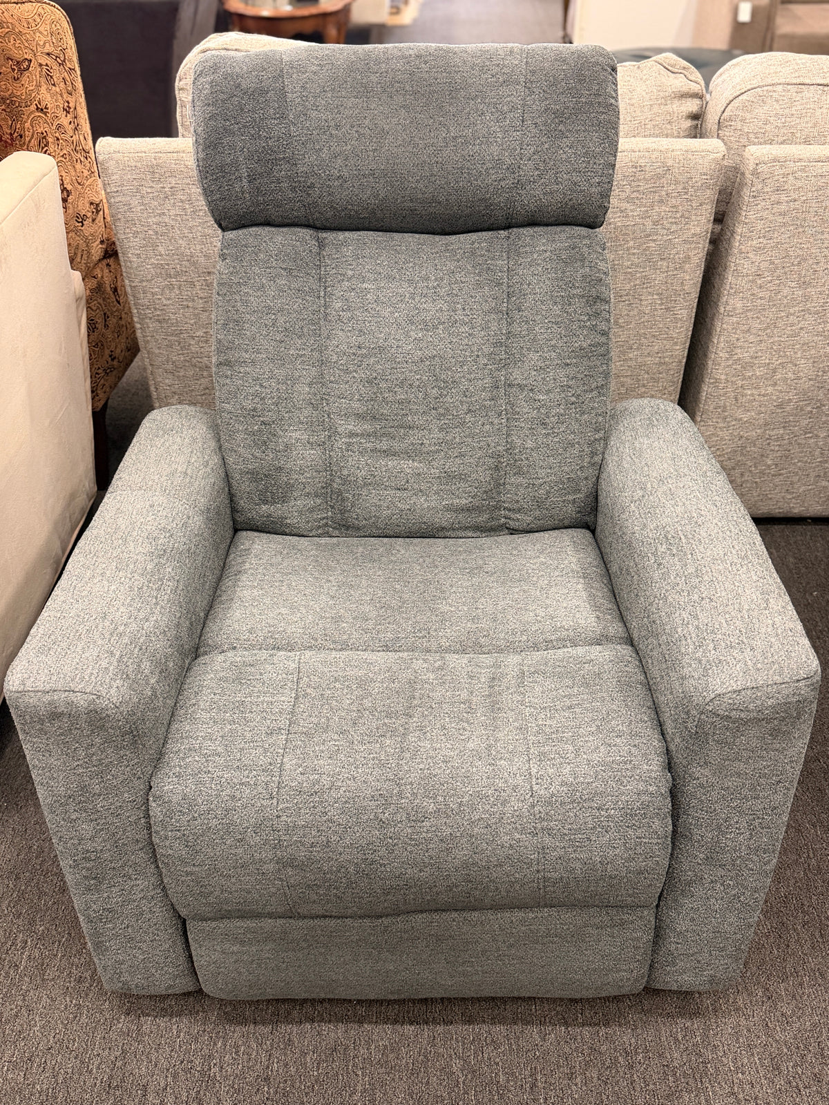A contemporary high-back power recliner armchair upholstered in heather-gray woven fabric featuring segmented back cushioning and padded track arms in excellent condition.