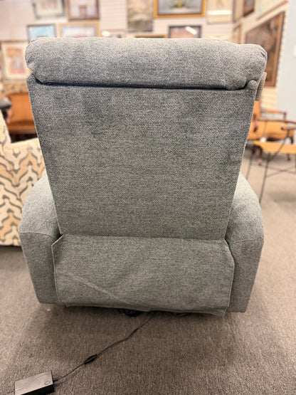 A contemporary high-back power recliner armchair upholstered in heather-gray woven fabric featuring segmented back cushioning and padded track arms in excellent condition.
