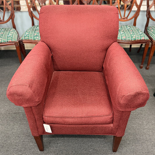 A contemporary plush fabric armchair featuring wide rounded track arms, a T-cushion seat, and a supportive square backrest.