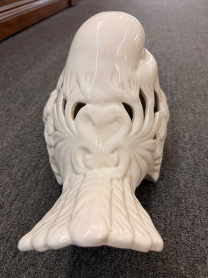 A cream glazed ceramic bird figurine featuring decorative openwork cutout hearts designed to hold a tealight or small candle in excellent condition.