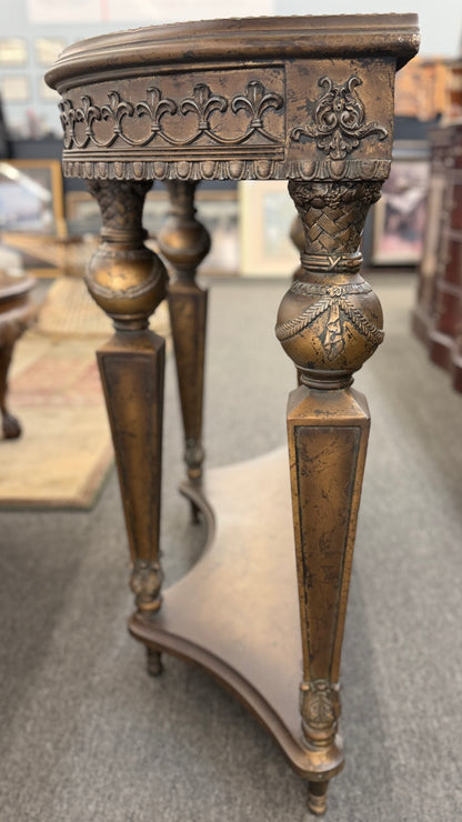 Distressed wood console table featuring ornate carved details, a center drawer, sculpted legs, and a gracefully curved lower stretcher.