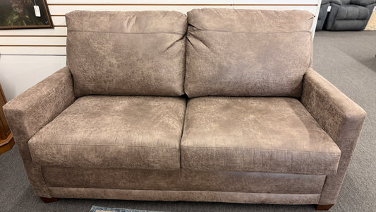 A plush two-seater sleeper sofa with pillow-top backrests and tapered track arms in textured distressed taupe-brown fabric.