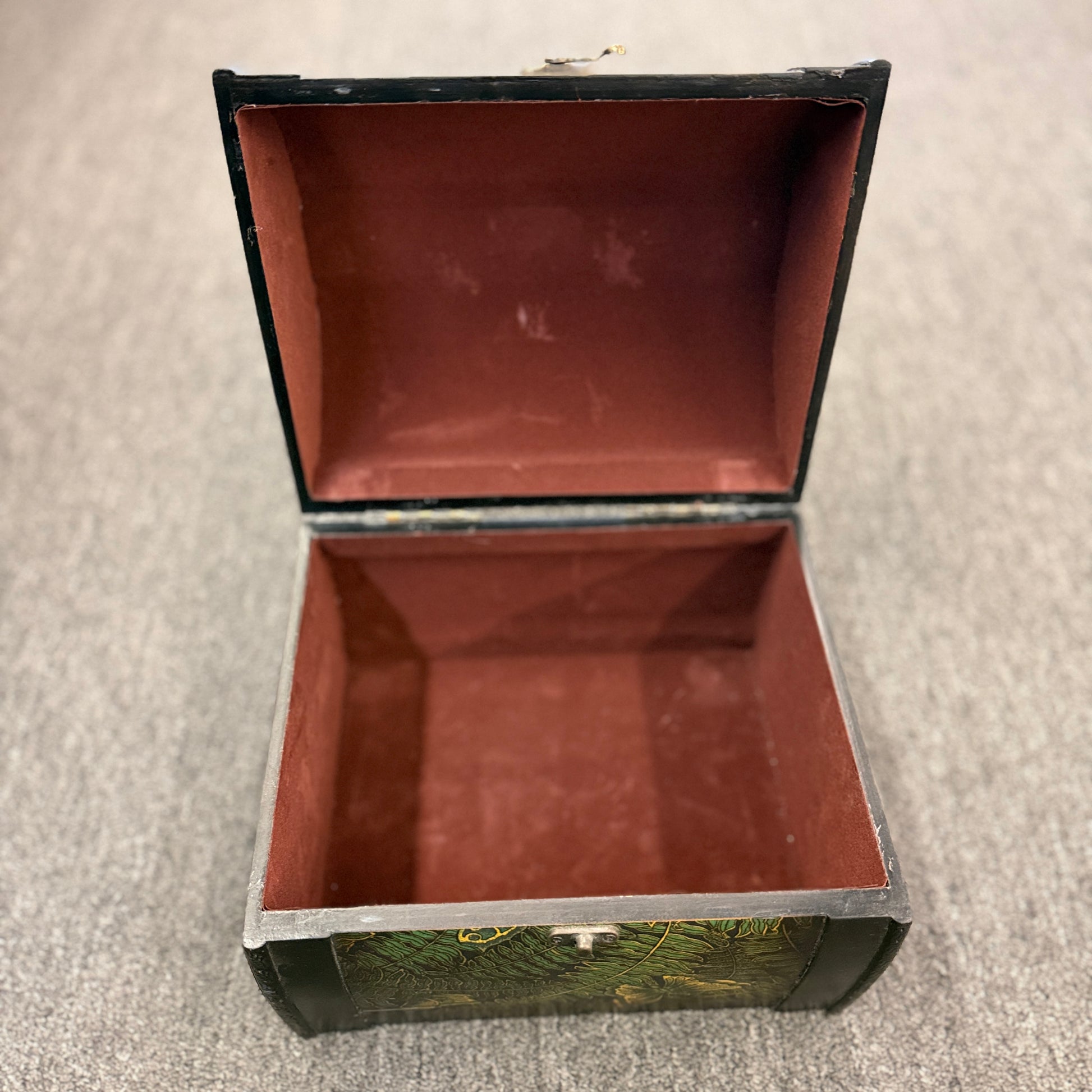 A small domed-top wooden treasure chest featuring green fern patterns, gold butterfly motifs, a metal swing clasp, and top handle in good condition.