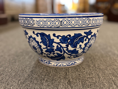 An elegant decorative oriental ceramic bowl resting on a flat surface in excellent condition.