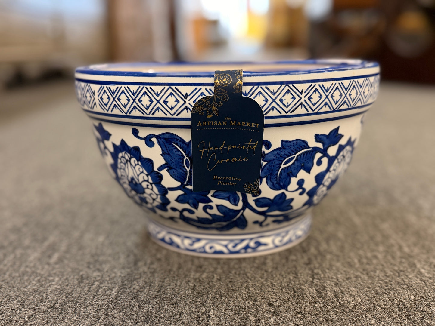 An elegant decorative oriental ceramic bowl resting on a flat surface in excellent condition.