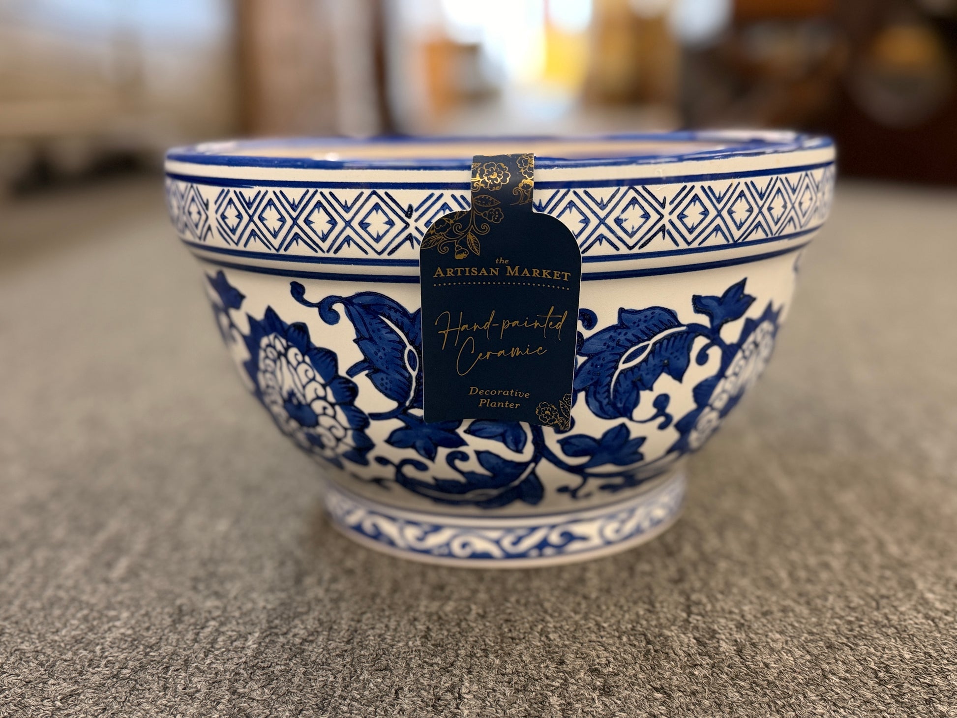 An elegant decorative oriental ceramic bowl resting on a flat surface in excellent condition.