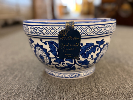 An elegant decorative oriental ceramic bowl resting on a flat surface in excellent condition.