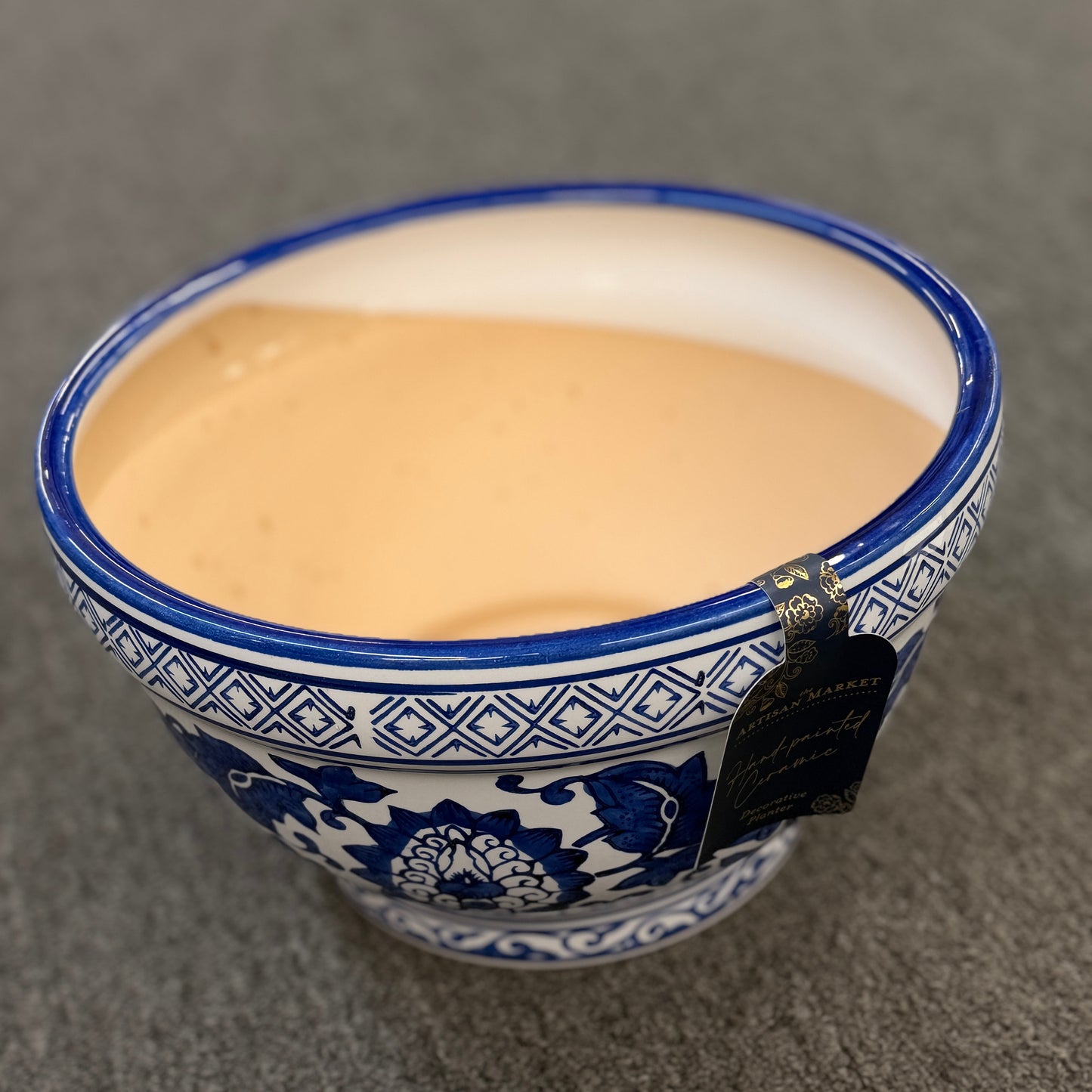 An elegant decorative oriental ceramic bowl resting on a flat surface in excellent condition.