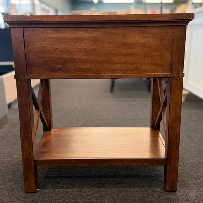 A traditional Ethan Allen wooden nightstand featuring a single top drawer, X-brace side panels, and an open lower shelf in good condition.