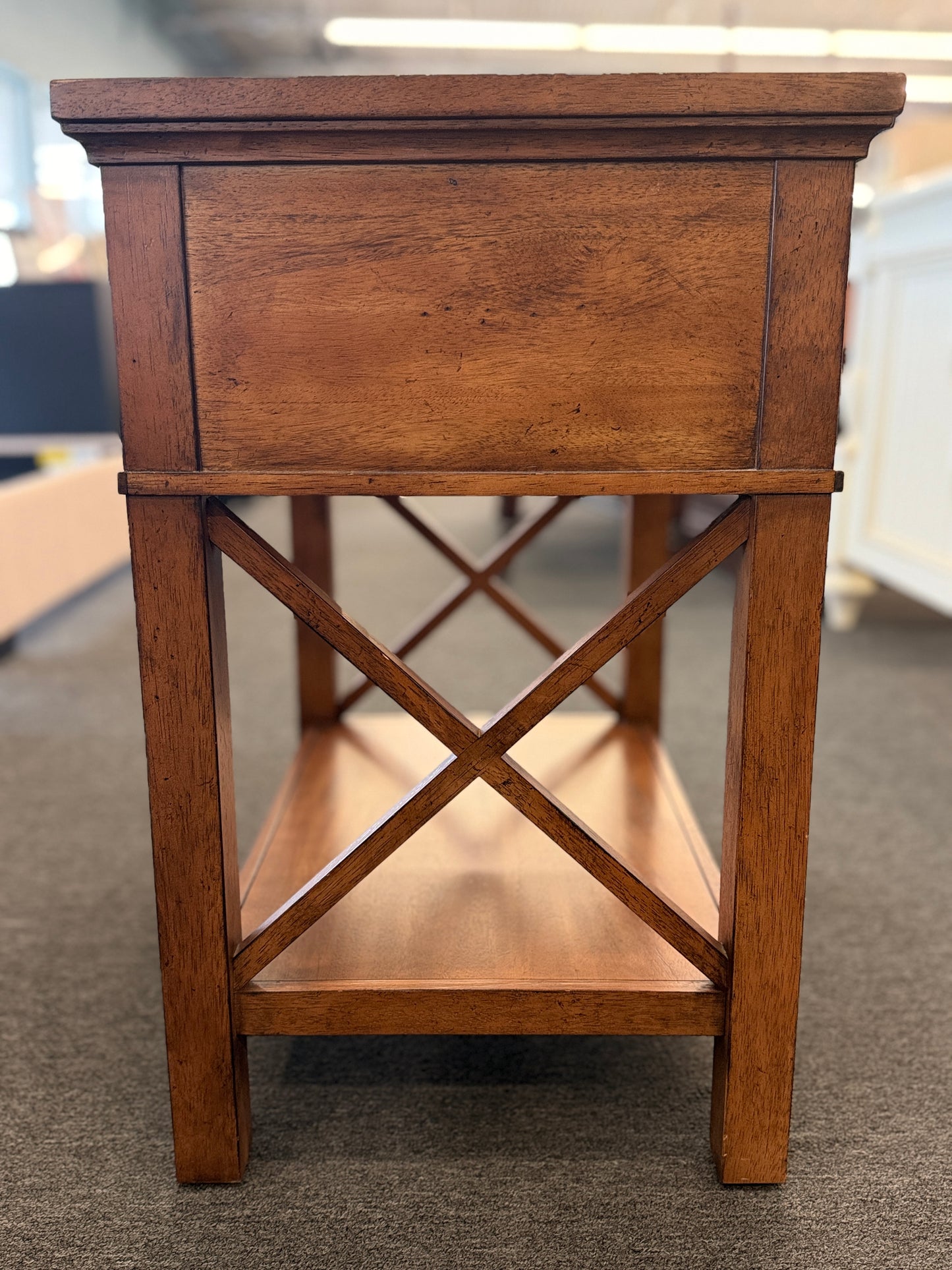 A traditional Ethan Allen wooden nightstand featuring a single top drawer, X-brace side panels, and an open lower shelf in good condition.