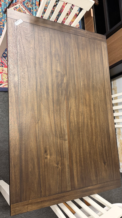 A farmhouse-style rectangular dining set with a dark-stained wood table top, antique white base, and four matching white slat-back chairs in excellent condition.