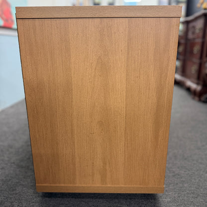 A low-profile minimalist TV stand cabinet featuring textured tambour-style vertical fluted sliding doors in good condition.