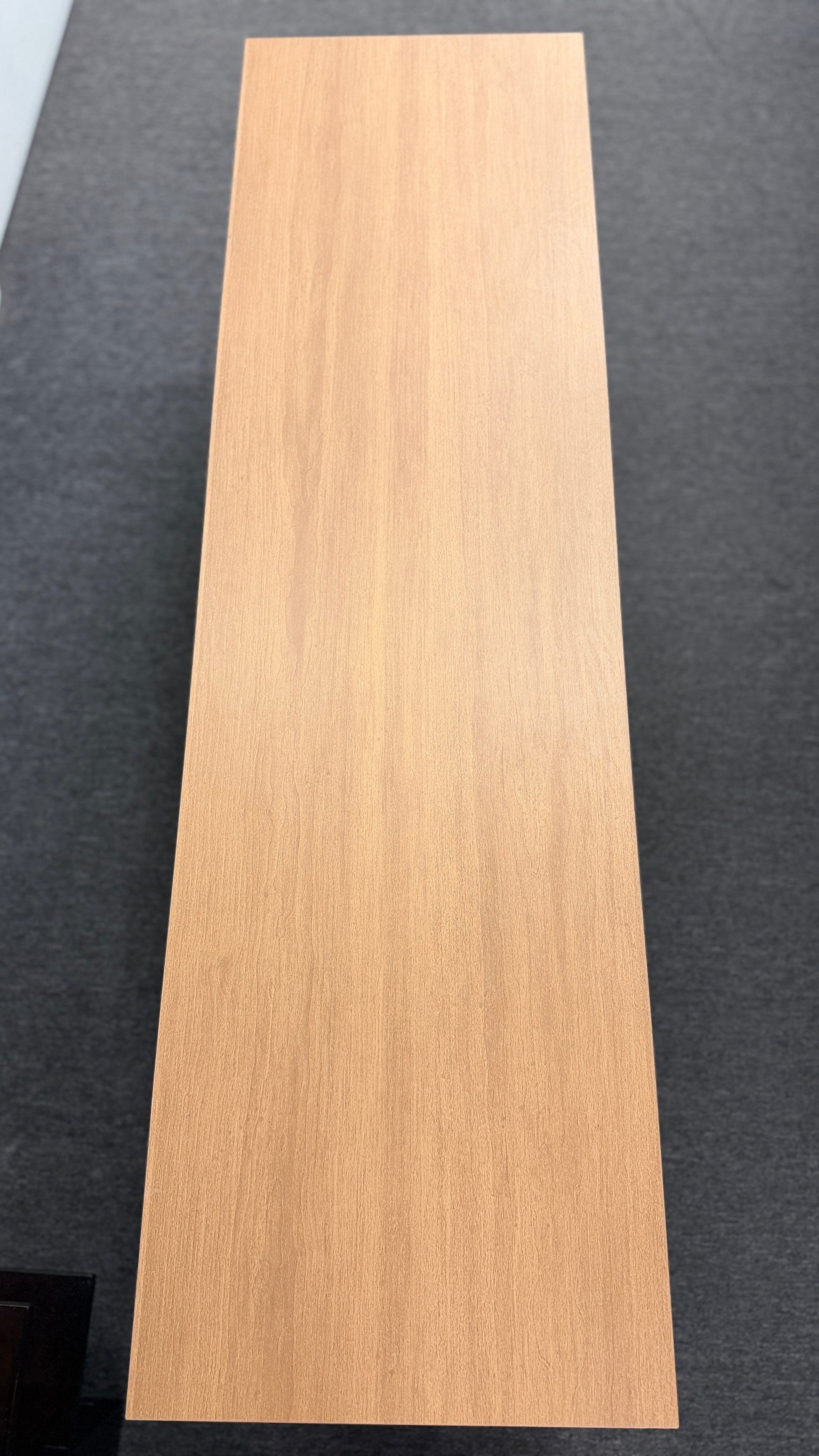A low-profile minimalist TV stand cabinet featuring textured tambour-style vertical fluted sliding doors in good condition.