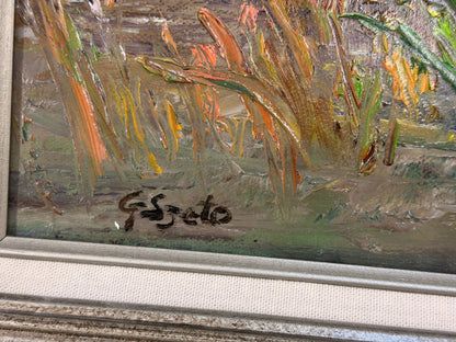 A framed Impressionist-style oil painting depicting a sunlit water lily pond, encased in a molded gray-blue and silver frame in excellent condition.