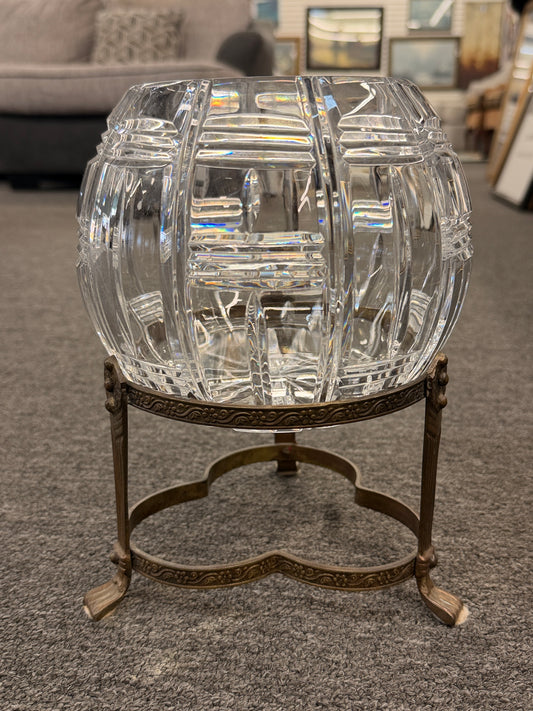 A geometric cut-crystal bowl set on an ornate antique brass-finished tripod stand in excellent condition.