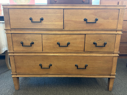 Traditional golden brown wood 6 drawer dresser featuring a unique multi tier layout and drop handles at 2nd Debut Houston consignment showroom