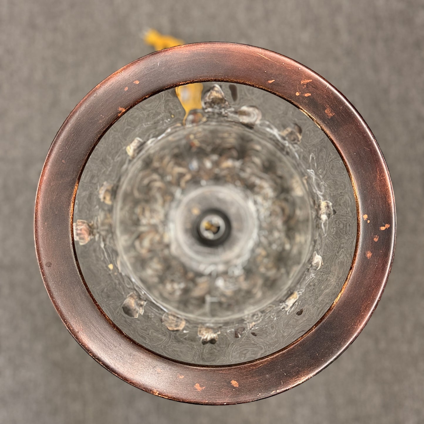 A decorative table lamp constructed from iron, ceramic, and glass in excellent condition.