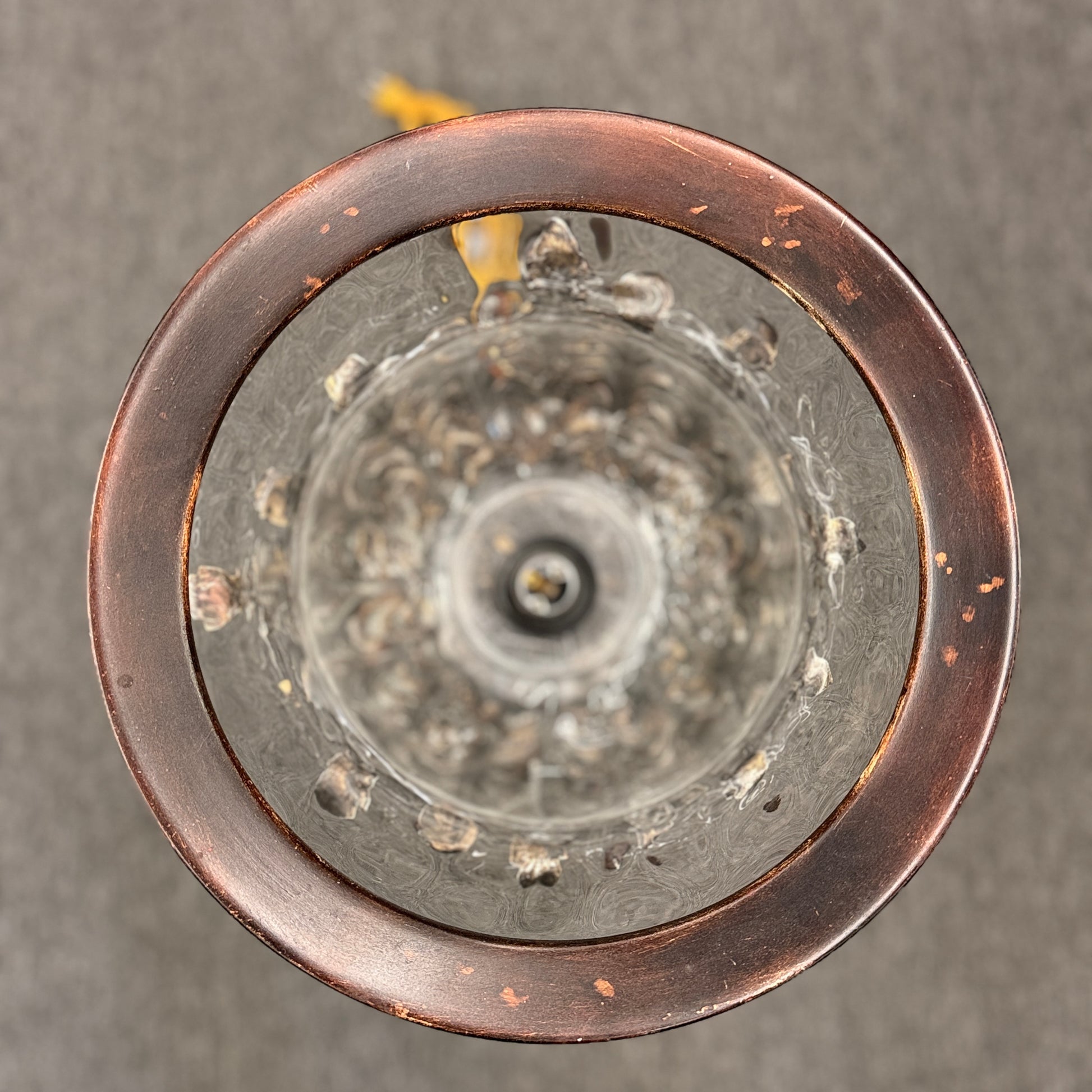 A decorative table lamp constructed from iron, ceramic, and glass in excellent condition.