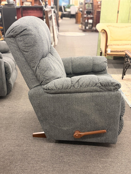 A plush fabric and wood La-Z-Boy reclining armchair in excellent condition.