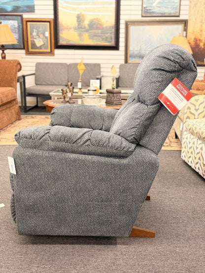A plush fabric and wood La-Z-Boy reclining armchair in excellent condition.