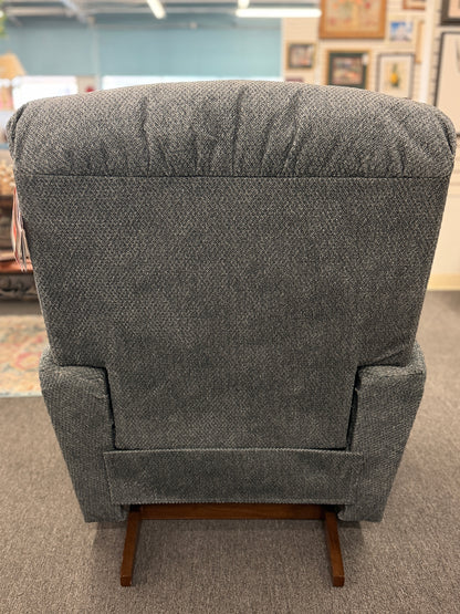A plush fabric and wood La-Z-Boy reclining armchair in excellent condition.