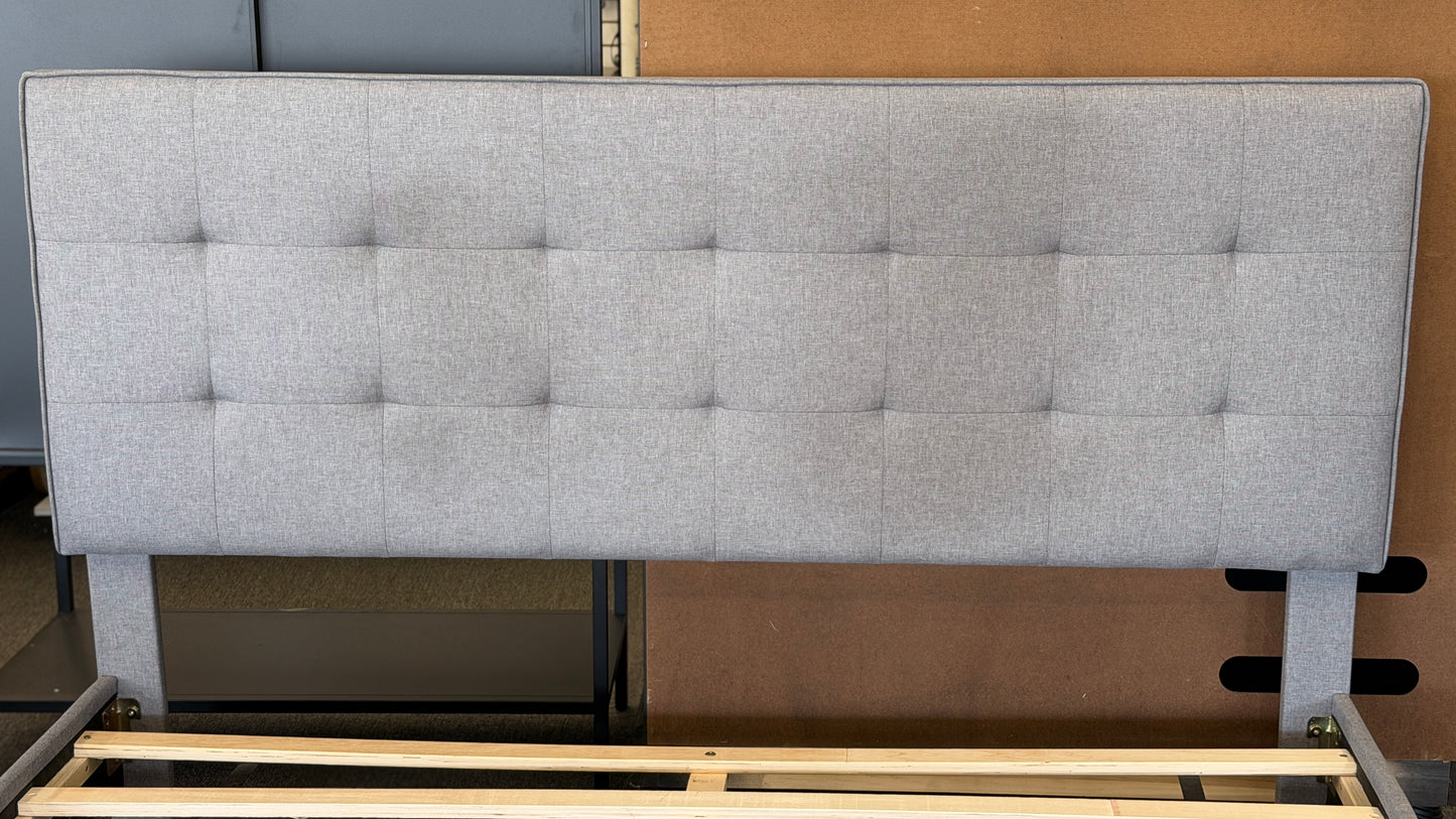 Light gray upholstered queen platform bed featuring a button-tufted headboard, matching upholstered side rails, dark tapered wooden legs, and wooden slat mattress support.